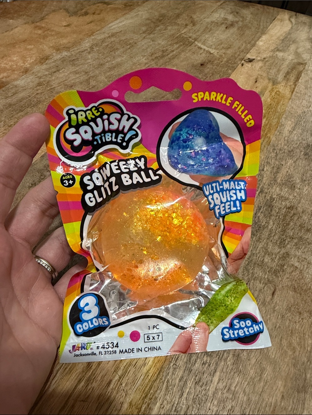 Irresistible Squishy Tible Squeezy Glitz Ball - Orange Sparkle